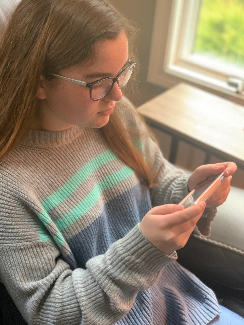 Kaylyn Wilson, 12, works through French exercises at home in Massachusetts on the Rosetta Stone app. Many language-learning software companies have offered students free accounts during school shutdowns to contain the coronavirus.