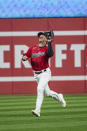 Cleveland Guardians' Myles Straw catches a fly ball by Kansas City Royals' Kyle Isbel during the sixth inning of a baseball game in Cleveland, Saturday, Oct. 1, 2022. (AP Photo/Phil Long)