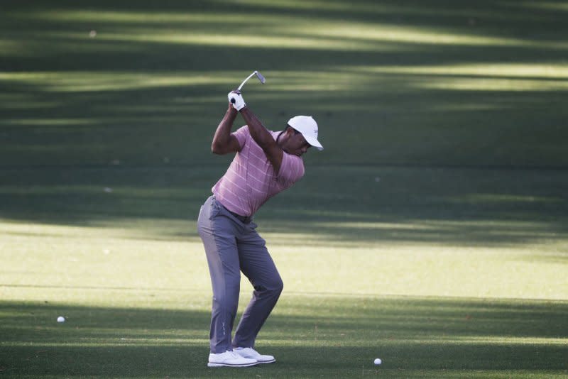 Tiger Woods takes his second shot on the eighth hole during the first round of the Masters Tournament on Thursday at Augusta National Golf Club in Augusta, Ga. Photo by Tannen Maury/UPI