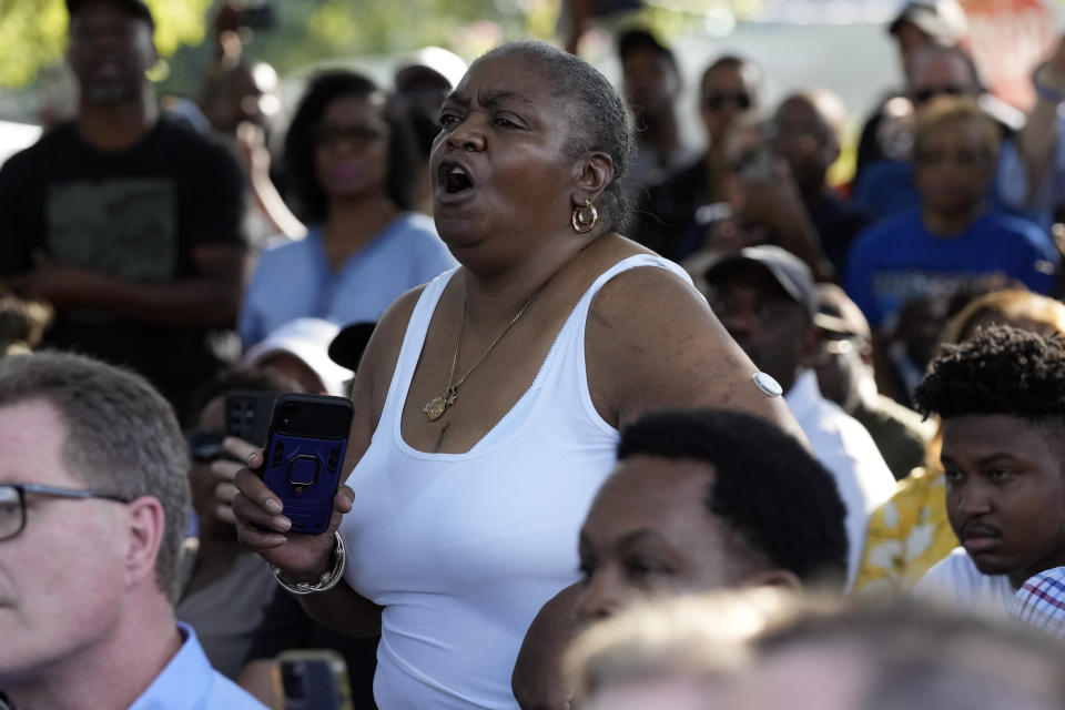A local resident shouts as Florida Gov. Ron DeSantis makes remarks during a prayer vigil for the victims of Saturday's mass shooting Sunday, Aug. 27, 2023, in Jacksonville, Fla. (AP Photo/John Raoux)