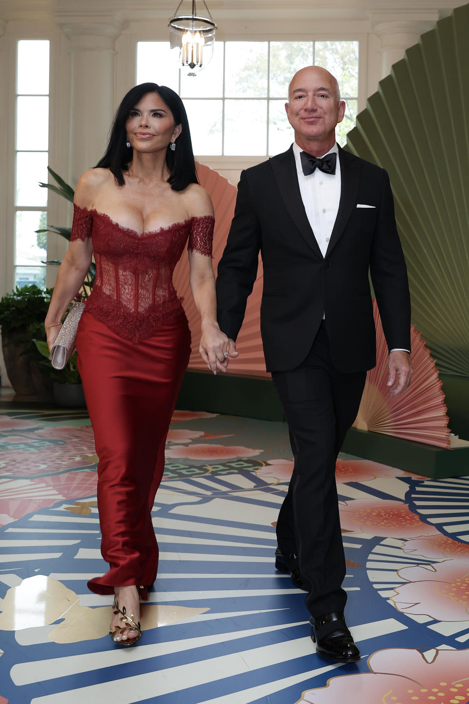 WASHINGTON, DC - APRIL 10: Amazon founder Jeff Bezos (R) and his fiancee Lauren Sanchez arrive at the White House for a state dinner on April 10, 2024 in Washington, DC. U.S. President Joe Biden and first lady Jill Biden are hosting a state dinner for Japanese Prime Minister Fumio Kishida as part of his official state visit.  (Photo by Tasos Katopodis/Getty Images)