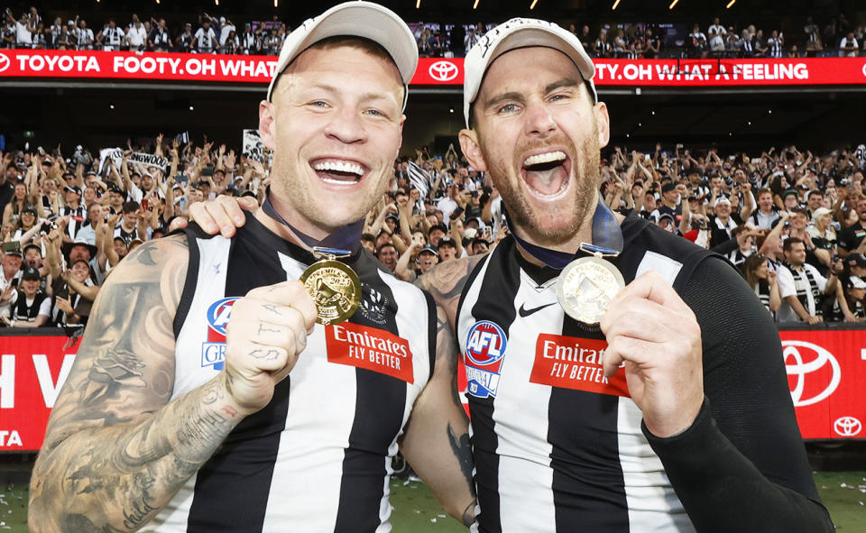 Jordan de Goey and Jeremy Howe, pictured here celebrating with their premiership medals.