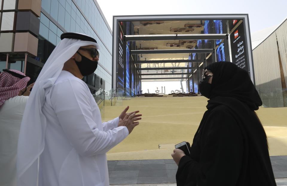 Journalists arrive for visiting the Israeli pavilion during a media tour at the Dubai Expo in Dubai, United Arab Emirates, Monday, Sept. 27, 2021. Delayed a year over the coronavirus pandemic, Dubai's Expo 2020 opens this Friday. It will put this city-state all-in on its bet of billions of dollars that the world's fair will boost its economy. (AP Photo/Kamran Jebreili)