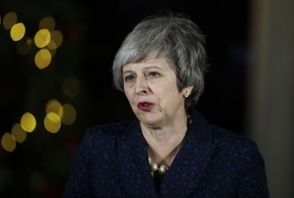 Britain's Prime Minister Theresa May delivers a speech outside 10 Downing Street in London, Wednesday, Dec. 12, 2018. British Prime Minister Theresa May survived a brush with political mortality Wednesday, winning a no-confidence vote of her Conservative lawmakers that would have ended her leadership of party and country. (AP Photo/Matt Dunham)