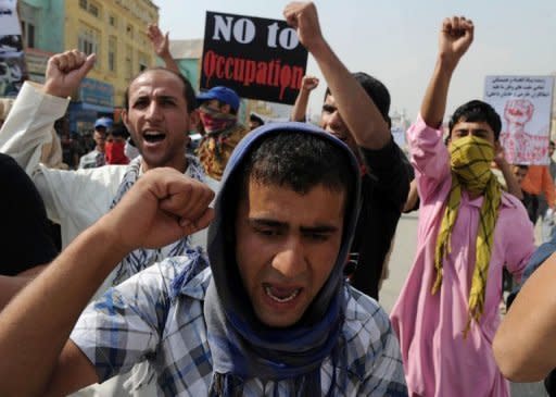 Afghan protestors shout anti-US slogans during a demonstration in Kabul. Afghans are marking 10 years since US warplanes began bombing the Taliban out of power