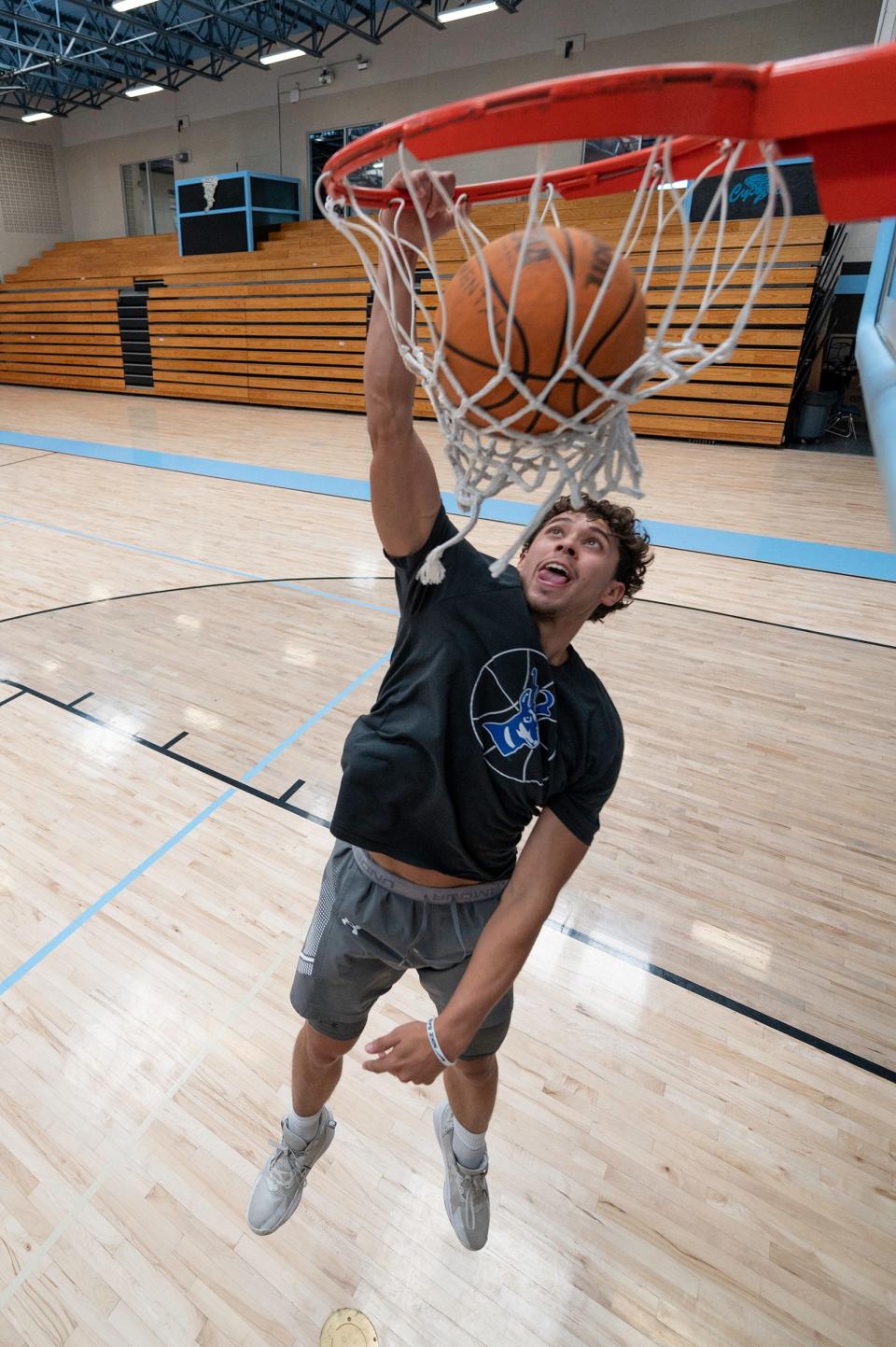 David Simental goes up for a dunk while working out at Pueblo West High School on Thursday, August 3, 2023.