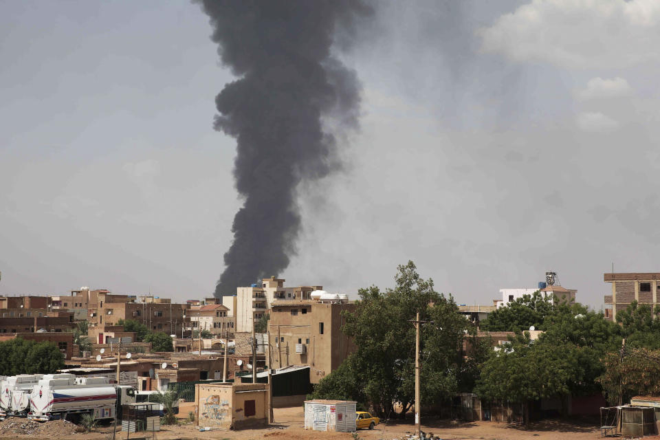 FILE - Smoke rises over Khartoum, Sudan, on June 8, 2023, as fighting between the Sudanese army and paramilitary Rapid Support Forces continues. A leading human rights group said on Thursday Aug. 3, 2023 Sudan's warring parties have committed “extensive war crimes” including mass killings of civilians, rape and sexual slavery of women in the ongoing conflict. (AP Photo, File)