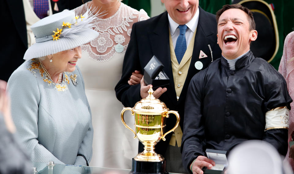 ASCOT, UNITED KINGDOM - JUNE 20: (EMBARGOED FOR PUBLICATION IN UK NEWSPAPERS UNTIL 24 HOURS AFTER CREATE DATE AND TIME) Queen Elizabeth II presents jockey Frankie Dettori with his prize after he rode 'Stradivarius' to victory in the Gold Cup on day three, Ladies Day, of Royal Ascot at Ascot Racecourse on June 20, 2019 in Ascot, England. (Photo by Max Mumby/Indigo/Getty Images)