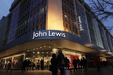 Shoppers pass in front of John Lewis department store in Oxford Street in central London, January 4, 2012. REUTERS/Finbarr O'Reilly