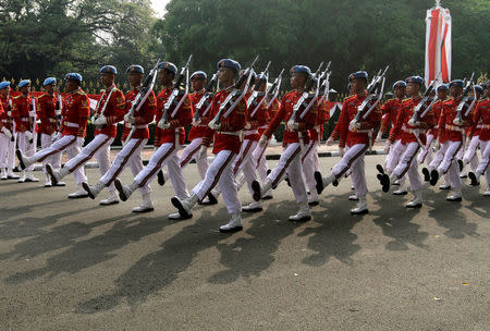 FILE PHOTO: Soldiers from the presidential guard take part in a changing of the guard ceremony outside the presidential palace in Jakarta, Indonesia July 17, 2016. REUTERS/Iqro Rinaldi/File Photo