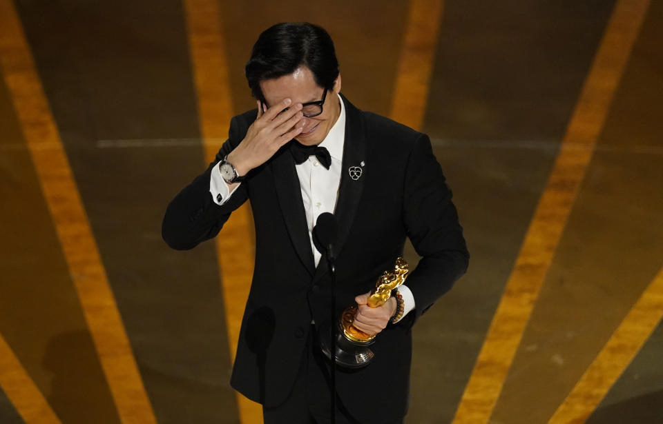 FILE - Ke Huy Quan accepts the award for best performance by an actor in a supporting role for "Everything Everywhere All at Once" at the Oscars on Sunday, March 12, 2023, at the Dolby Theatre in Los Angeles. (AP Photo/Chris Pizzello)