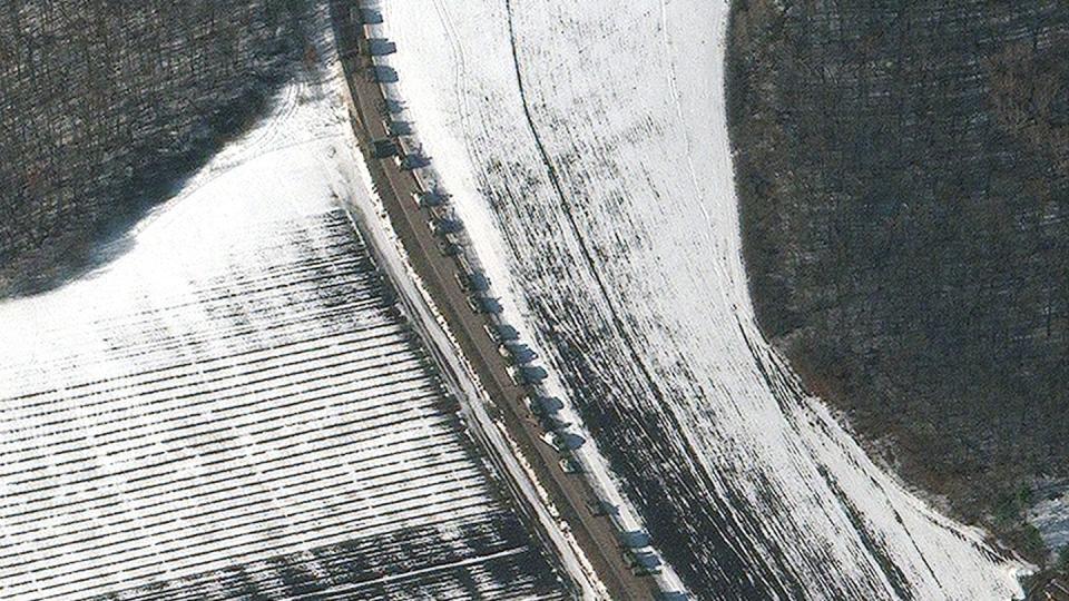 This satellite image shows armor and self-propelled artillery in a military convoy heading west near Sergievka, Russia, on Feb. 24, 2022 (Maxar Technologies)