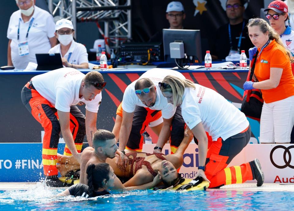 Alvarez is placed on to a stretcher poolside (Reuters)
