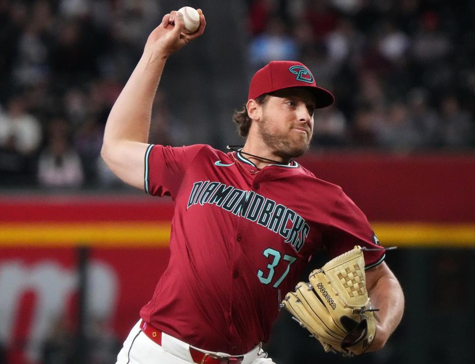 Arizona Diamondbacks' Kevin Ginkel (37) pitches against the Colorado Rockies at Chase Field in Phoenix on March 31, 2024.