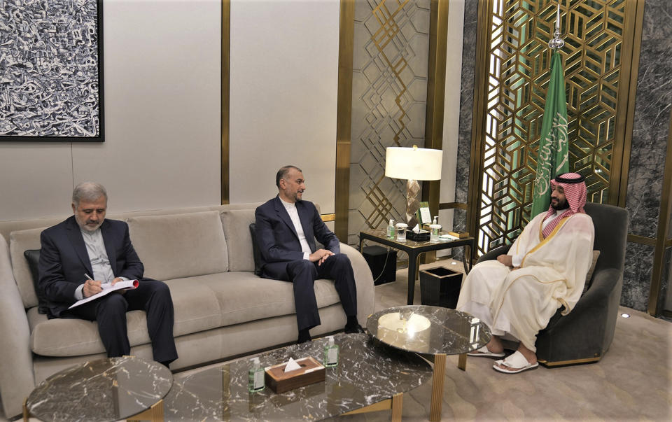 In this picture released by the Iranian Foreign Ministry, Iran's Foreign Minister Hossein Amirabdollahian, center, meets with Saudi Arabia's Crown Prince Mohammed bin Salman, right, in Jeddah, Saudi Arabia, Friday, Aug. 18, 2023. Iran's foreign minister traveled to Saudi Arabia on Thursday, marking the first trip to the kingdom by Tehran's top diplomat in years after the two nations reached a détente with Chinese mediation. The man at left is unidentified. (Iranian Foreign Ministry via AP)