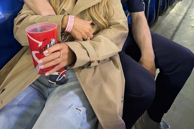 Dani Dyer and Jarrod Bowen in a football stadium's stands together.