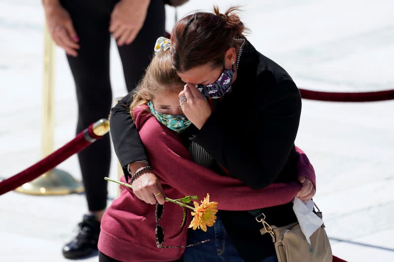 People pay respects as Justice Ruth Bader Ginsburg lies in repose under the Portico at the top of the front steps of the U.S. Supreme Court building