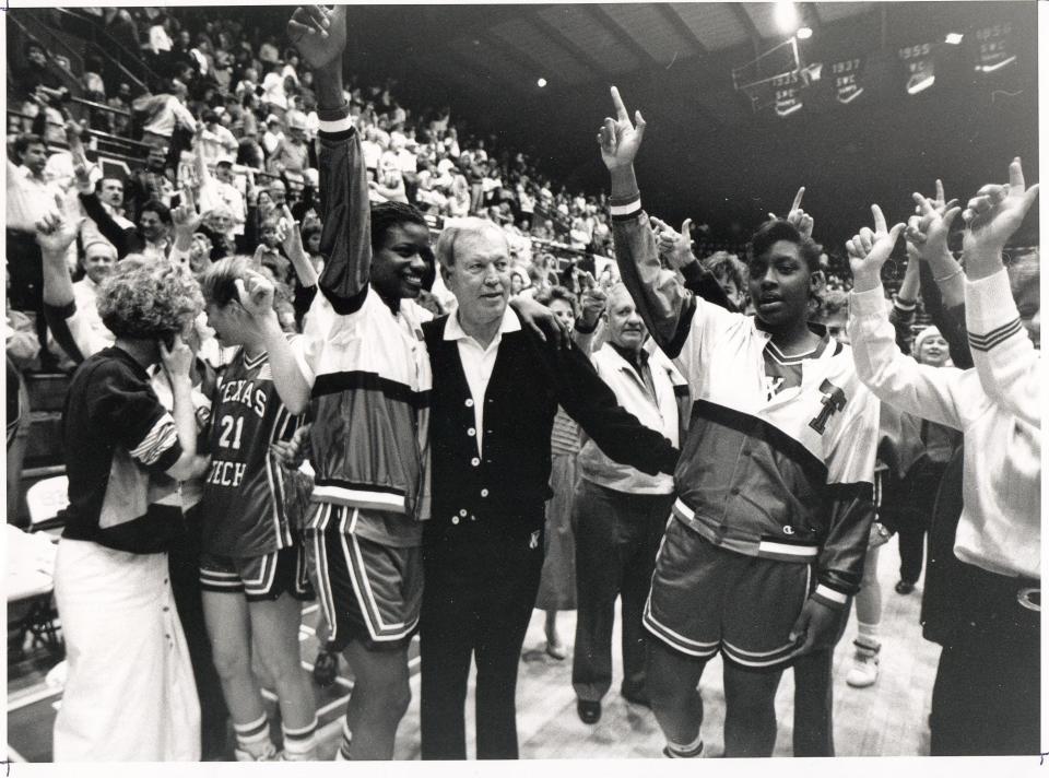 Texas Tech athletics director T. Jones celebrates with Lady Raiders basketball players. The Lady Raiders won the national championship in 1993, which was late in Jones' eight-year tenure as Tech AD. [PROVIDED BY TEXAS TECH ATHLETICS]