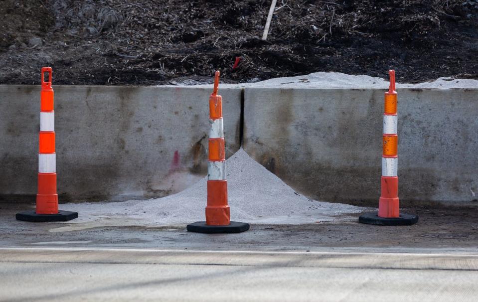 Construction and cleanup at the site of a chemical spill on I-696 in Madison Heights, Monday, Dec. 23, 2019. While the liquid is now cleaned up, there is now an absorbent material at the base of the spill.