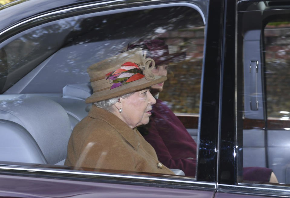 Britain's Queen Elizabeth II arrives to attend a morning church service at St Mary Magdalene Church in Sandringham, England, Sunday Jan. 12, 2020. Prince Harry and his wife Meghan have declared they will “work to become financially independent” as part of a surprise announcement saying they wish "to step back" as senior members of the royal family. (Joe Giddens/PA via AP)