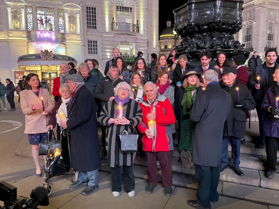 Holocaust survivors, including Steven Frank (front, centre), held candles in Piccadilly Circus to mark Holocaust Memorial Day (Sophie Wingate/PA) (PA Wire)