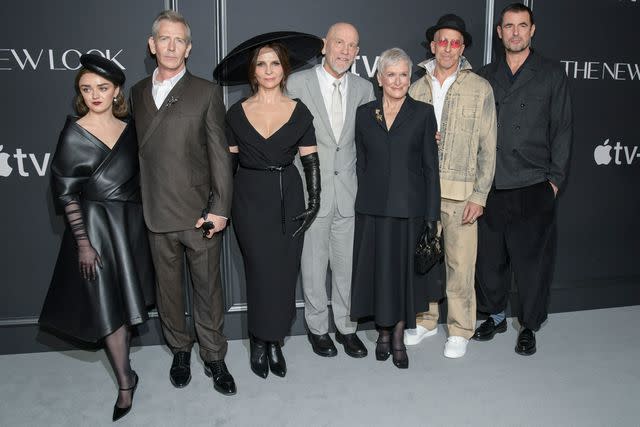 <p>Kristina Bumphrey/Variety via Getty</p> Maisie Williams, Ben Mendelsohn, Juliette Binoche, John Malkovich, Glenn Close, Todd A. Kessler and Claes Bang at the premiere of 'The New Look' on February 12, 2024