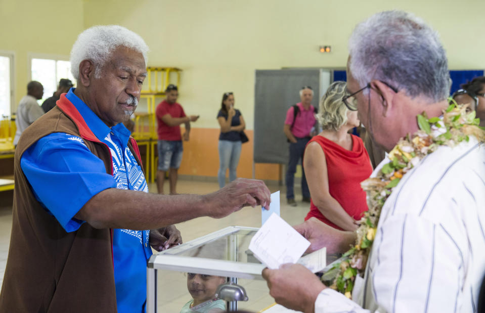 Roch Wamytan, one of the former leaders of the independentist party, Union Caledonienne, casts his vote at a poling station in Le Mont-Dore, New Caledonia during an independence referendum, Sunday, Nov. 4, 2018. Voters in New Caledonia are deciding whether the French territory in the South Pacific should break free from the European country that claimed it in the mid-19th century. (AP Photo/Mathurin Derel)