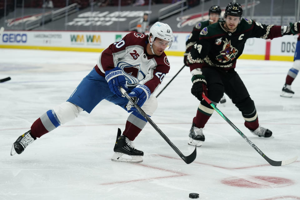 Colorado Avalanche left wing Brandon Saad (20) skates away from Arizona Coyotes defenseman Oliver Ekman-Larsson (23) in the first period during an NHL hockey game, Tuesday, March 23, 2021, in Glendale, Ariz. (AP Photo/Rick Scuteri)