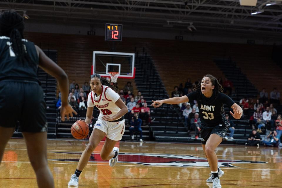 Marist's Zaria Shazer drives toward the paint while defended by Army's Fiona Hastick during a Nov. 9, 2023 women's basketball game.