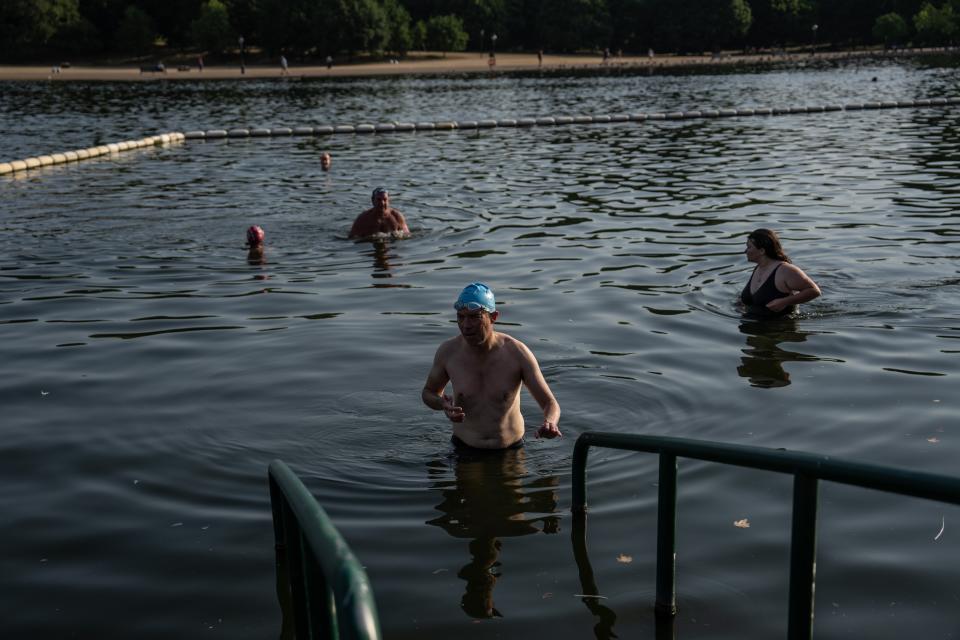 People enjoy an early morning swim at the Serpentine Lido (Getty Images)