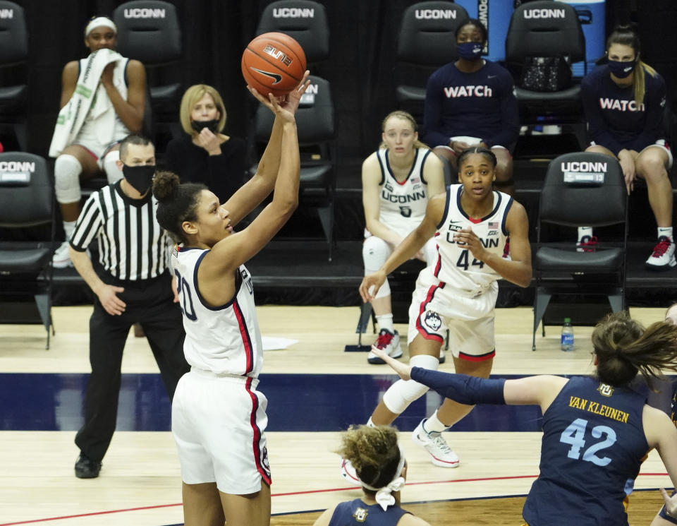 Connecticut forward Olivia Nelson-Ododa (20) makes a basket against Marquette in the second half of an NCAA college basketball game Monday, March 1, 2021, in Storrs, Conn. (David Butler II/Pool Photo via AP)