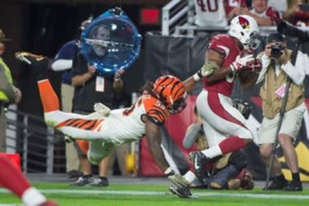 Arizona Cardinals running back David Johnson (31, right) scores a touchdown against Cincinnati Bengals outside linebacker Vontaze Burfict (55, left) during the third quarter at University of Phoenix Stadium. The Cardinals defeated the Bengals 34-31. Mandatory Credit: Kyle Terada-USA TODAY Sports