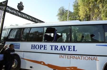 A damaged bus is seen after an attack by gunmen on Tunisia's national museum in Tunis March 18, 2015. REUTERS/Zoubeir Souissi