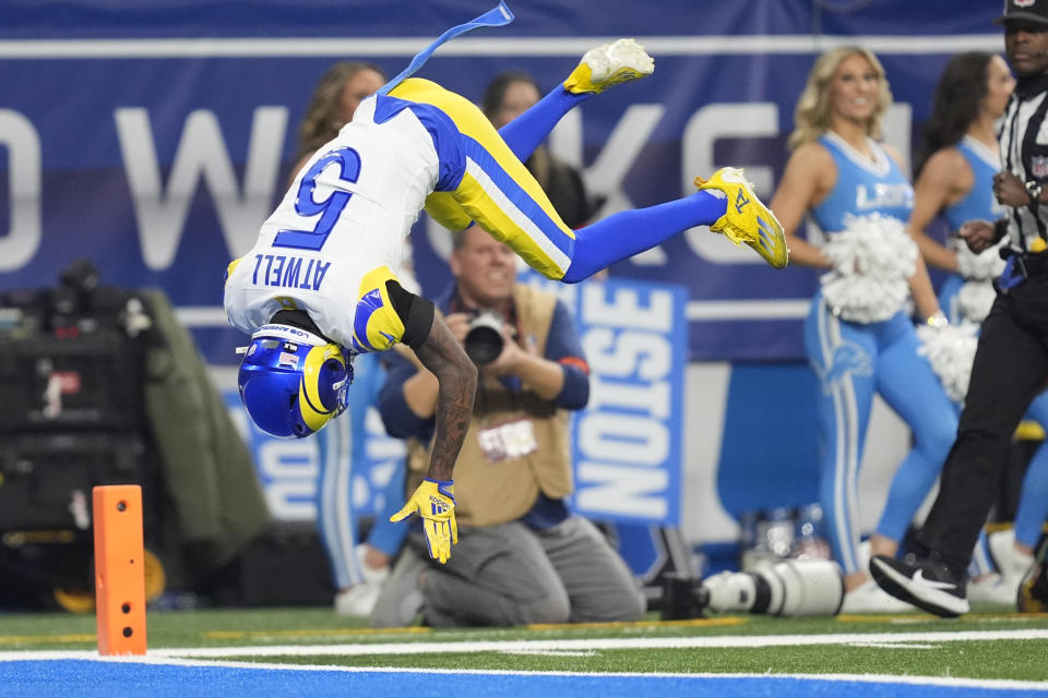 Los Angeles Rams wide receiver Tutu Atwell (5) flips into the endzone after a 38-yard reception for a touchdown during the first half of an NFL wild-card playoff football game against the Detroit Lions, Sunday, Jan. 14, 2024, in Detroit. (AP Photo/Paul Sancya)