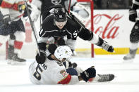 Los Angeles Kings left wing Austin Wagner, top, collides with Florida Panthers defenseman Aaron Ekblad during the second period of an NHL hockey game Thursday, Feb. 20, 2020, in Los Angeles. (AP Photo/Mark J. Terrill)