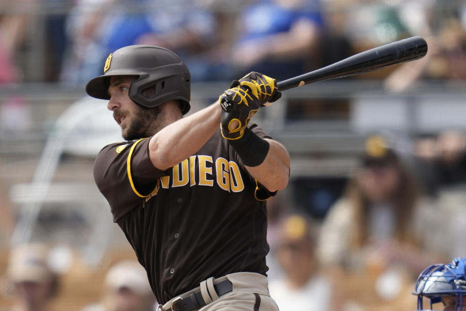 San Diego Padres designated hitter Austin Nola (26) follows through on a swing during the second inning of a spring training baseball game against the Los Angeles Dodgers in Glendale, Calif., Monday, March 6, 2023. (AP Photo/Ashley Landis)