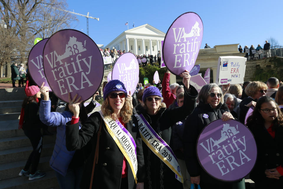 FILE - In this Wednesday, Jan. 8, 2020, file photo, Equal Rights Amendment supporters demonstrate outside Virginia State Capitol in Richmond, Va. Virginia moved a step closer to ratifying the Equal Rights Amendment on Tuesday, Jan. 1,4 2020, even as the measure's future nationally remains in doubt. A House committee approved a resolution to ratify the gender equality measure, which advocates hope will become the next amendment to the U.S. Constitution. (AP Photo/Steve Helber, File)