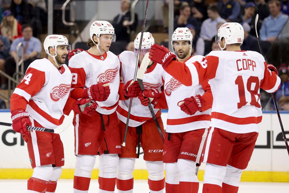 Detroit Red Wings defenseman Moritz Seider (53) celebrates his goal against the New York Rangers with center Robby Fabbri (14) and right wing Daniel Sprong (17) and center Joe Veleno (90) and center Andrew Copp (18) during the second period at Madison Square Garden in New York on Wednesday, Nov. 29, 2023.