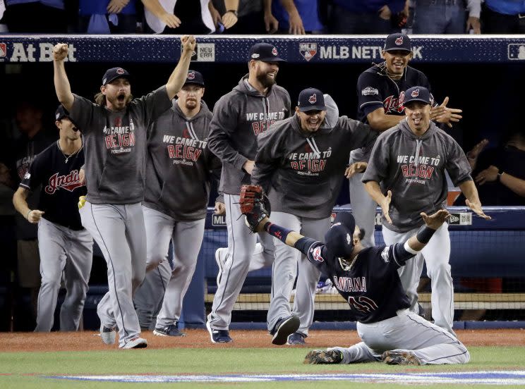 Cleveland Indians first baseman Carlos Santana celebrates after making the final out during the ninth inning in Game 5 of baseball's American League Championship Series against the Toronto Blue Jays in Toronto, Oct. 19, 2016. (Photo: Charlie Riedel/AP)