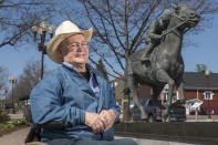 Ron Turcotte poses next to a statue of him and Secretariat in Grand Falls, New Brunswick, Canada, on Wednesday, May 31, 2023. Turcotte rose to the heights of the horse racing world, riding Secretariat to a sweep of the Kentucky Derby, Preakness and Belmont in 1973. (AP Photo/Stephen MacGillivray)