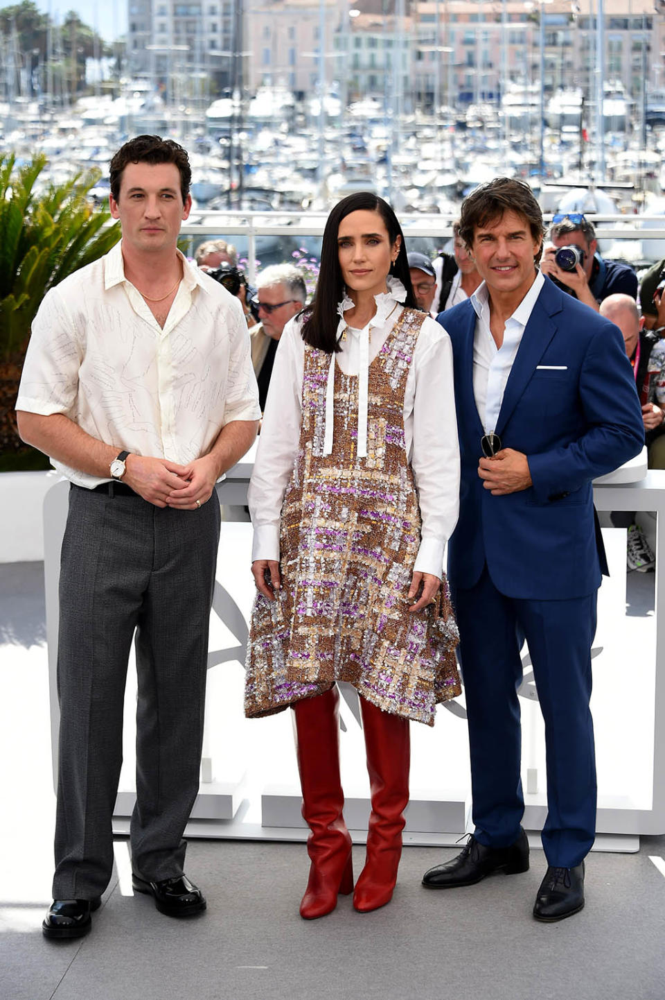 (L-R) Miles Teller, Jennifer Connelly and Tom Cruise at a ‘Top Gun: Maverick’ photo call during the Cannes Film Festival in France on May 18, 2022. - Credit: maximon / MEGA