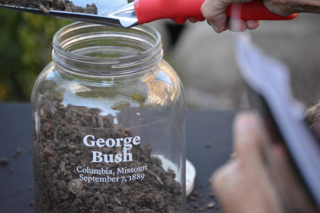 Jars are filled with soil located from the approximate location of the lynching of Black Boone County teenager George Bush in 1889 outside the old county courthouse.