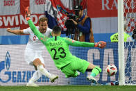 <p>England’s forward Harry Kane (L) attempts to score past Croatia’s goalkeeper Danijel Subasic during the Russia 2018 World Cup semi-final football match between Croatia and England at the Luzhniki Stadium in Moscow on July 11, 2018. (Photo by MANAN VATSYAYANA / AFP) </p>