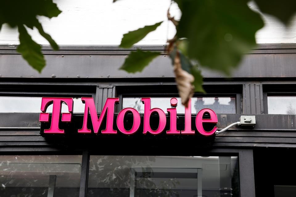Signage for T-Mobile hangs on a storefront on August 24, 2023 in Washington, DC.