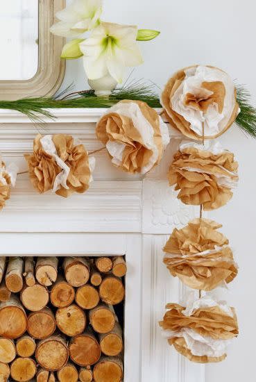 <p>You really can use anything to make pretty Christmas decorations if you put your mind to it. This garland is made out of coffee filters! If you don't have any of those lying around, use tissue paper and make an afternoon of it. Get the tutorial from <em><a href="https://www.countryliving.com/diy-crafts/how-to/g1798/recycled-crafts-holiday-decor/?slide=6" rel="nofollow noopener" target="_blank" data-ylk="slk:Country Living;elm:context_link;itc:0;sec:content-canvas" class="link ">Country Living</a>. </em></p>