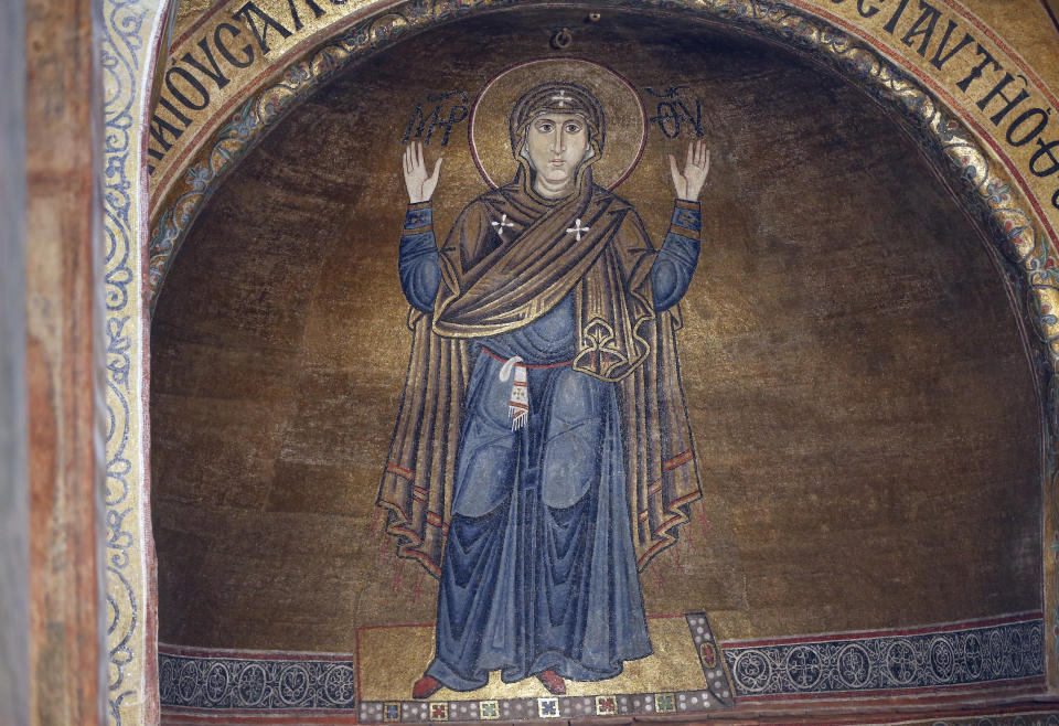 A view of the Mosaic Oranta, an Orthodox Christian depiction of the Virgin Mary in prayer with extended arms, from the 11th century, 6 meter high, dominates the interior of the St.Sophia Cathedral in Kiev, Ukraine, Monday, Jan. 7, 2019. Ukraine marks Orthodox Christmas and celebrates the independence of the Ukrainian Orthodox Church in the St. Sophia Cathedral. (AP Photo/Efrem Lukatsky)