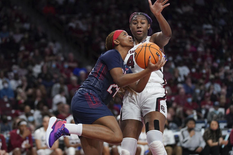 South Carolina forward Aliyah Boston (4) defends as Howard forward Brooklynn Fort-Davis (24) shoots during the first half of a first-round game in the NCAA women's college basketball tournament Friday, March 18, 2022 in Columbia, S.C. South Carolina won 79-21. (AP Photo/Sean Rayford)