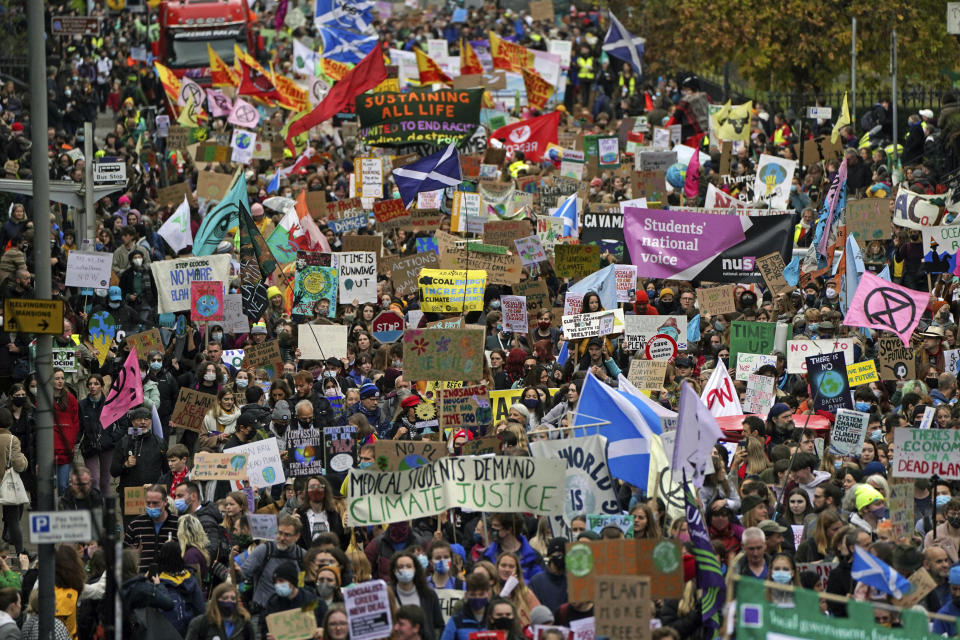 Climate activists march during a demonstration in the center of Glasgow, Scotland, Friday, Nov. 5, 2021, which is the host city of the COP26 U.N. Climate Summit. A protest is taking place as leaders and activists from around the world are gathering in Scotland's biggest city for the U.N. climate summit, to lay out their vision for addressing the common challenge of global warming. (Andrew Milligan/PA via AP)