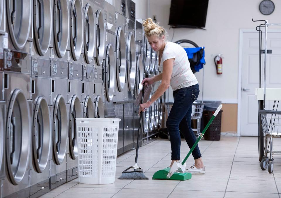 Wasco Clean Coin Laundry employee works to maintain the company's facility in Car City on Sept. 23.