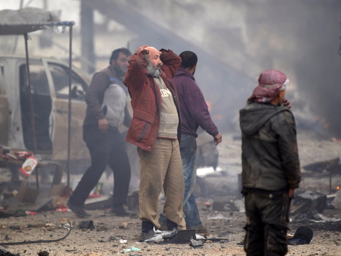 Residents of Aleppo, Syria react to a bombing